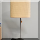 D14. Metal lamp with basketweave shade. 